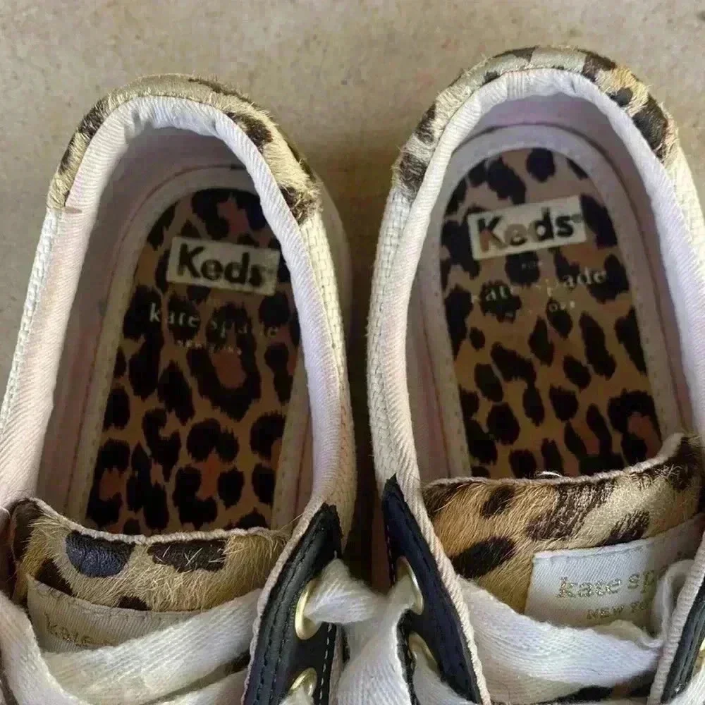 Keds beige canvas sneakers with black trim and leopard heel